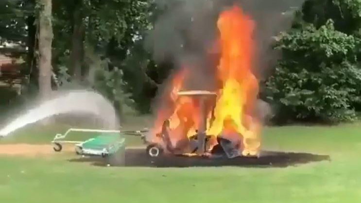 WATCH: Golfers try to put out HUGE golf buggy fire
